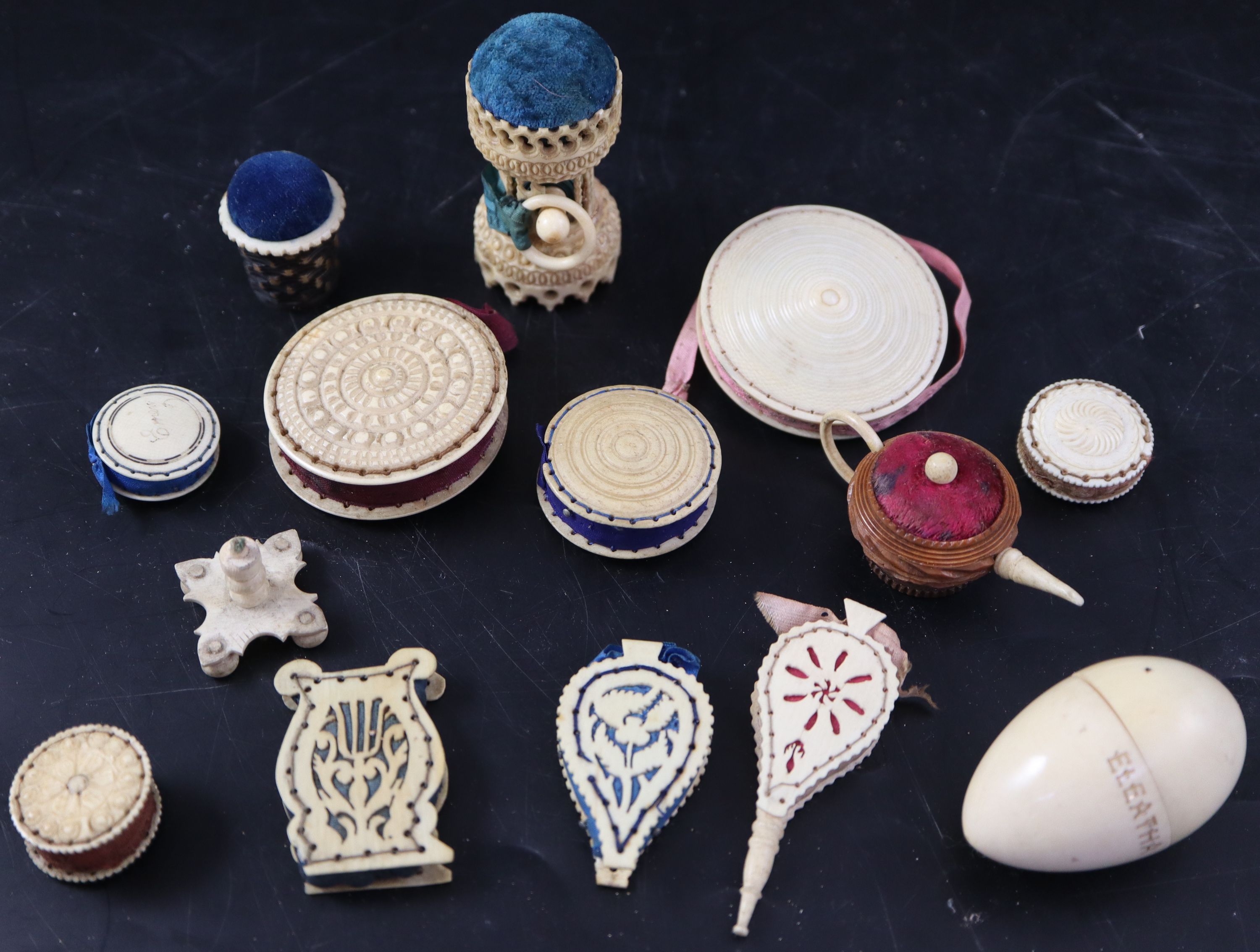 A collection of twelve assorted 19th century ivory pin cushions